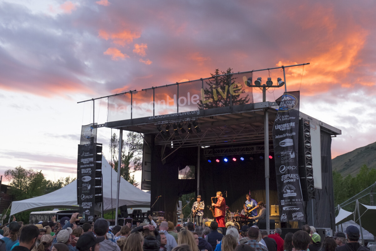 Jackson Hole Live Summer Concert Series stage with crowd at sunset